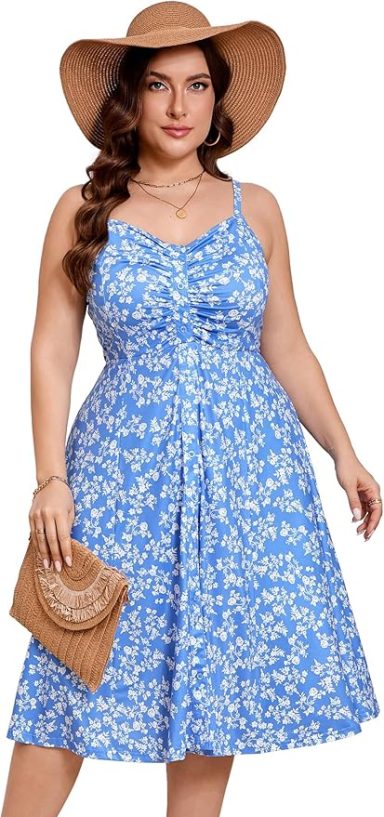 A woman in a blue floral dress and sunhat, holding a straw bag.